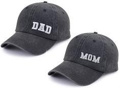 two baseball caps with the words dad and mom embroidered on each one in white letters