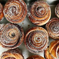 many different types of pastries on a tray