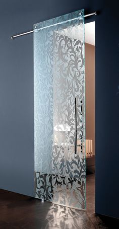 a glass door with an intricate design on it