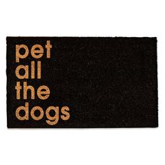 a black door mat with the words pet all the dogs written in gold on it