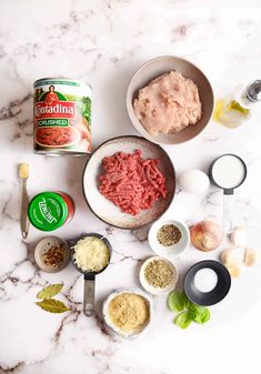 ingredients to make meatballs laid out on a marble counter top