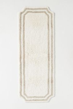 This hand-tufted bath mat offers both luxurious comfort and timeless stylefeaturing a plush texture and elegant double border design that elevates any bathroom's décor. Beige Bathroom Rugs, Master Bath Towels, Bath Mat Aesthetic, White And Beige Bathroom, Master Bath Rugs, Master Bath Decor