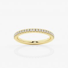 a yellow gold wedding band with white diamonds