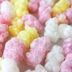 some type of candy that is pink, yellow and white