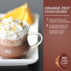 an orange zest chocolate drink with whipped cream and garnished with orange zest