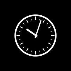 a black and white clock on a dark background with the time at 11 00 pm