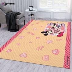 a living room with a mickey mouse rug on the floor and a chair in front of it