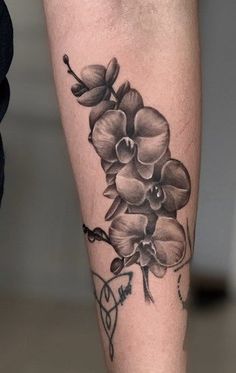 a black and white photo of a flower on the leg