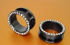 PAIR OF 7/8 " (22mm.) black titanium flesh tunnels with gems -This auction is for a set ( 2 items) of flesh tunnels 7/8 inch (22mm.). -The back is held on with by a threaded nut. -THESE BLING BLING TUNNELS ARE A GREAT ITEM TO WEAR OUT ON A NIGHT ON THE TOWN.  -THESE ARE ALL BLACK TITANIUM COATED 316L SURGICAL STEEL ITEMS.  -A PAIR LIKE THIS WOULD GO FOR MORE THAN $150.00 AT ANY STUDIO. -THESE ARE EXACTLY THE SAME STYLE AS THE ONES SEEN IN THE PICTURE. -THIS AND ALL MY JEWELERY IS NEW AND HAS NEVER BEEN WORN. THE PICTURE DOES NOT DO THIS PIECE JUSTICE. m129 Payment Shipping I ACCEPT PAYPAL PAYMENTS I SHIP OUT THE DAY AFTER PAYMENTS ARE RECIEVED SHIPPING IN A PADDED MAILER THANKS AND HAPPY BIDDING Flesh Tunnel, Same Style, Bling Bling, Body Jewelry, All Black, Jewelry Watches, Auction, Gems, Stone