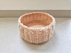 a crocheted bowl sitting on top of a counter