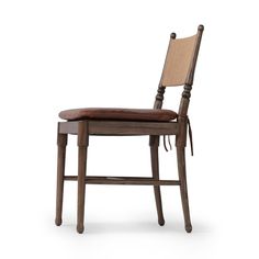 a wooden chair with a brown leather seat