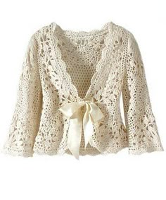 a crocheted cardigan with a bow on the front, and lace detailing