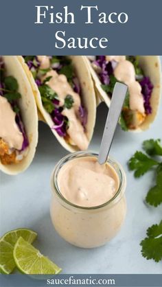 fish taco sauce in a jar with tortillas and cilantro on the side