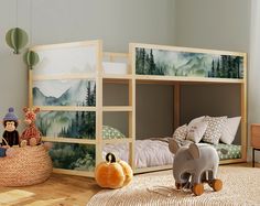 there are two children's bunk beds in this room, one has an elephant and the other is a bear