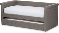 a gray toddler bed with a white pillow