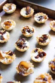 small appetizers on a baking sheet ready to be baked