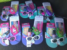 several pairs of flip flops with assorted items on them