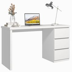 a white desk with a laptop on it and a flower in a vase next to it