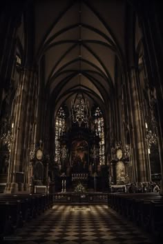 the interior of a gothic church with stained glass windows and pews, in front of a checkered floor