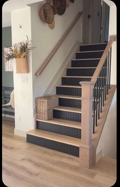 there is a set of stairs with baskets on the top and bottom handrails