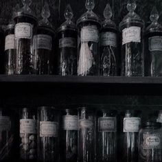 many jars are lined up on the shelves