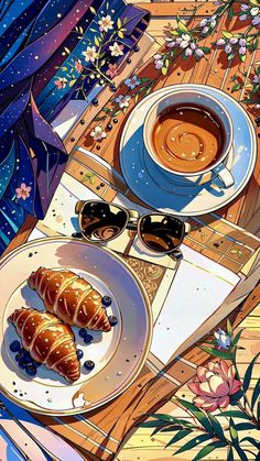 two croissants and coffee on a wooden table with flowers in the background