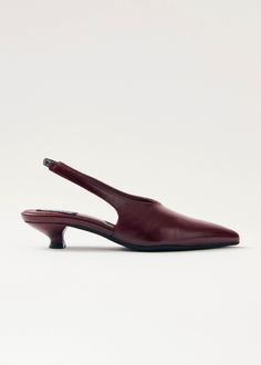 Burgundy crinkle-effect leather slingback pumps Crafted from burgundy crinkle-effect leather, the Eros pumps rest on a low 4mm heel and feature an elasticated slingback strap, ensuring non-negotiable comfort. The sharply pointed toe and minimalist, long vamp add the touch for an elegant silhouette. Finnish Fashion, Hand Towels Kitchen, Black Leather Pumps, Knit Bottom, Knit Alpaca, Weekender Tote Bag, Mary Jane Pumps, Half Zip Sweaters, Boot Bag