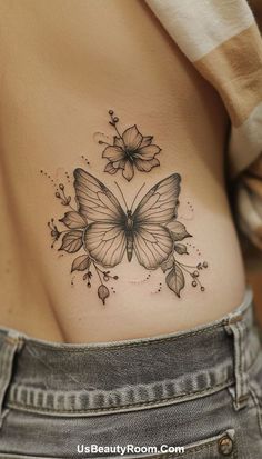 a woman with a butterfly tattoo on her stomach