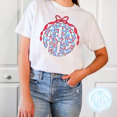 Unleash your wild side with our Red, White and Blue Leopard Monogram Tee! Featuring a playful mix of colors and patterns, this women's tee is perfect for adding a touch of fun to any outfit. Plus, with a monogram and bow detail, you can show off your individual style. Tees run true to size. If you have any questions please feel free to ask. Fabric & Care:Machine wash warm or cold with mild detergentDry on normal dryer settingsDo not dry cleanDo not iron over design. If ironing is needed iron on Spring Casual T-shirt With Monogram Print, Monogram Print Relaxed Fit Short Sleeve Top, Relaxed Fit Monogram Print Short Sleeve Tops, Trendy Cotton Tops With Monogram Print, Spring Cotton Monogram Print Tops, Spring Cotton Tops With Monogram Print, Relaxed Fit Monogram Print Summer Tops, Casual Tops With Monogram Print For Spring, Casual Monogram Print Tops For Spring