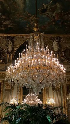 a large chandelier hanging from the ceiling in a room