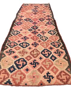 an old rug with geometric designs on it