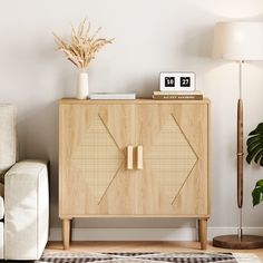 a living room with a white couch and a wooden cabinet in front of the wall