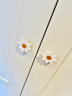 two white and orange flowers on the ceiling