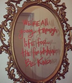 a mirror that has writing on it in red and gold colors with the words we're all young happy life for the sunshine be nice