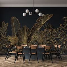 a dining room with a table and chairs in front of a black wall that has gold leaves on it