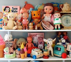 there are many toys on the shelves in this room, including teddy bears and children's toys