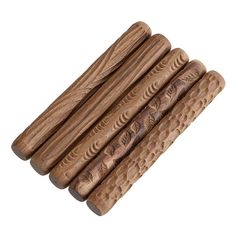 four wooden sticks are stacked on top of each other