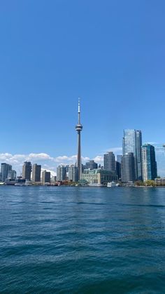 the city skyline is seen from across the water