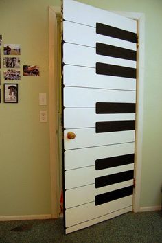 an open door with piano keys painted on it