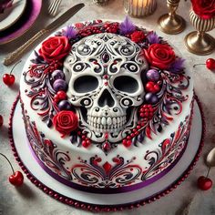 a decorated cake with red roses and skulls on it