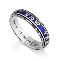 Hebrew / English ring, designed by Marina MeiriUnique display of Old Testament Shema lettered in debossed motif on blue enamel, finished with rich border Inside quote from the same prayerHear O Israel, the Lord our God is OneMost important Jewish prayer, recited daily by observant Jews to affirm their faithAlso the first words in the TorahFrom Deuteronomy 6:4-9Rich with meaning for people of the Jewish faith, portrayed in an elegant and contemporary jewelry designWhite gift boxMarina brings you Jewish Prayer, Deuteronomy 6, First Words, Contemporary Jewelry Design, Jewish Jewelry, Trendy Ring, Engraved Gifts, Enamel Jewelry, Contemporary Jewelry