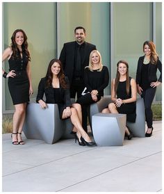 a group of women and men posing for a photo