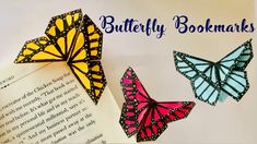 three paper butterflies with the words butterfly bookmarks written below them and an open book