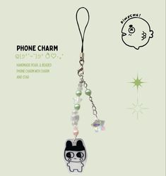 a cell phone charm with an image of a cartoon character on the front and back