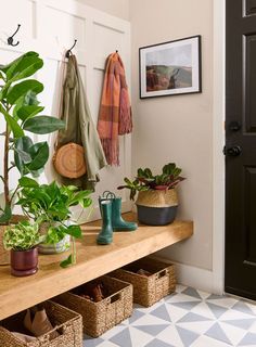 the entryway is filled with potted plants and other indoor plant care items, including rubber boots