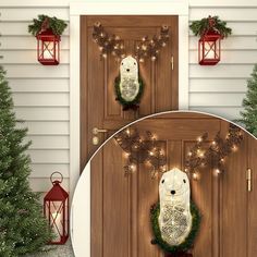 two christmas wreaths on the front door of a house with lights and lanterns around them