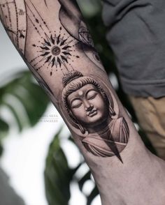 a person with a tattoo on their arm