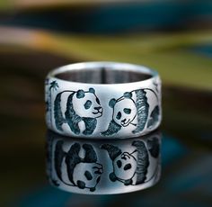 Wide ring with cute pandas playing in the bamboo forest 🐼 Couldn't resist. They are so cute.  Handmade from my own sketch.  Ring width 10 millimeters  I can make this ring in gold for you. Please send me a message for details. Panda Ring, Panda Jewelry, Pandas Playing, Bamboo Jewelry, Family Vector, Panda Family, Ring Boy, Magic Ring, Wide Rings