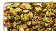 roasted brussel sprouts with parmesan cheese and seasoning on top