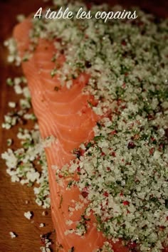 salmon fillets with herbs and seasoning on a cutting board